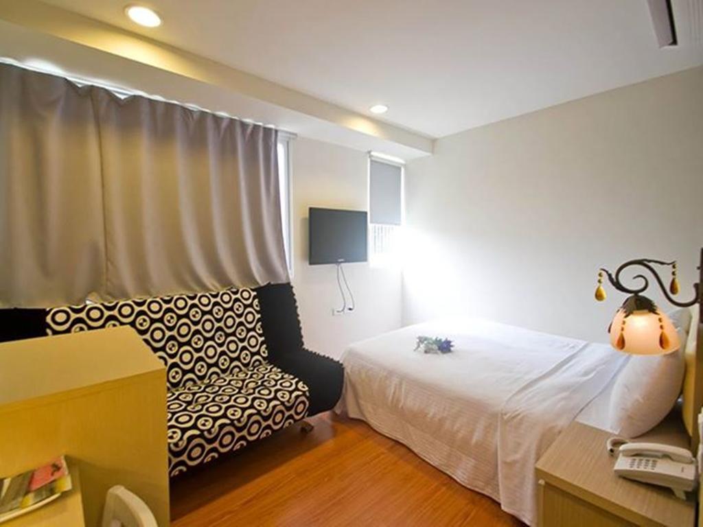 Green Park Commercial Hotel Тайнан Стая снимка